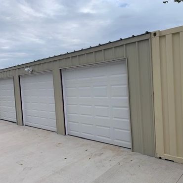 Container home garage placed between two shipping containers