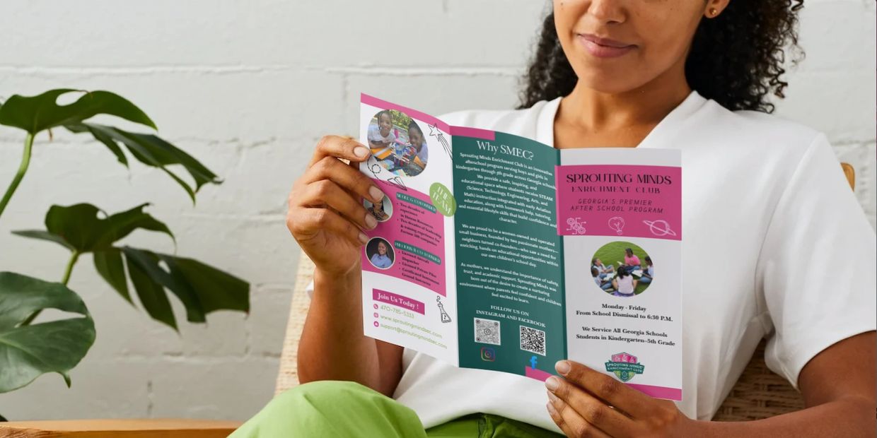 Woman reading pamphlet about STEM program for children.