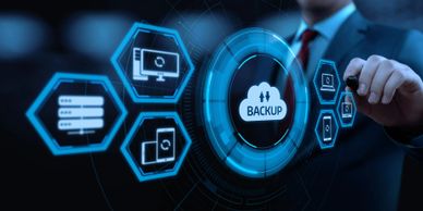 Businessman interacting with digital backup cloud interface in futuristic style.