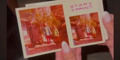 Hands holding a vintage photo print labeled STAR PRINT.