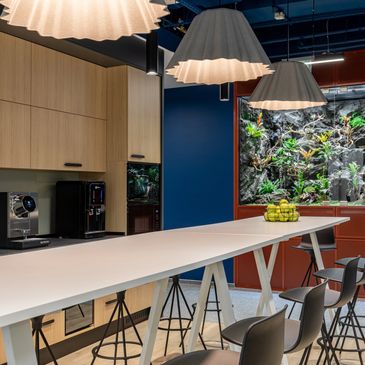 Contemporary workspace relaxing area with industrial accents,biophilic design,statement accoustic  