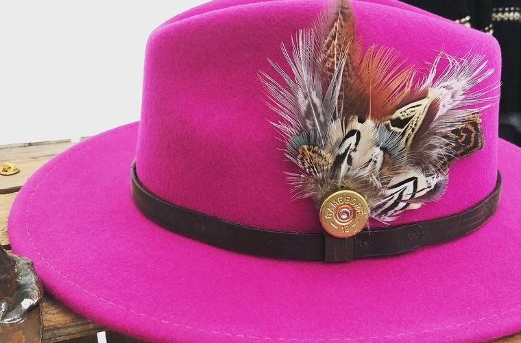 Our Fuchsia Pink classic wool felt fedora with game feather pin.  