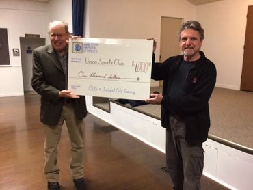 Jim Parkins, Union South Yarmouth Optimist Club, presents cheque to Tim Dobson, Union Comm. Centre