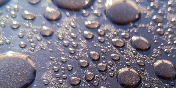Beading from the application of Beeswax with Coconut oil over Cellulose paintwork