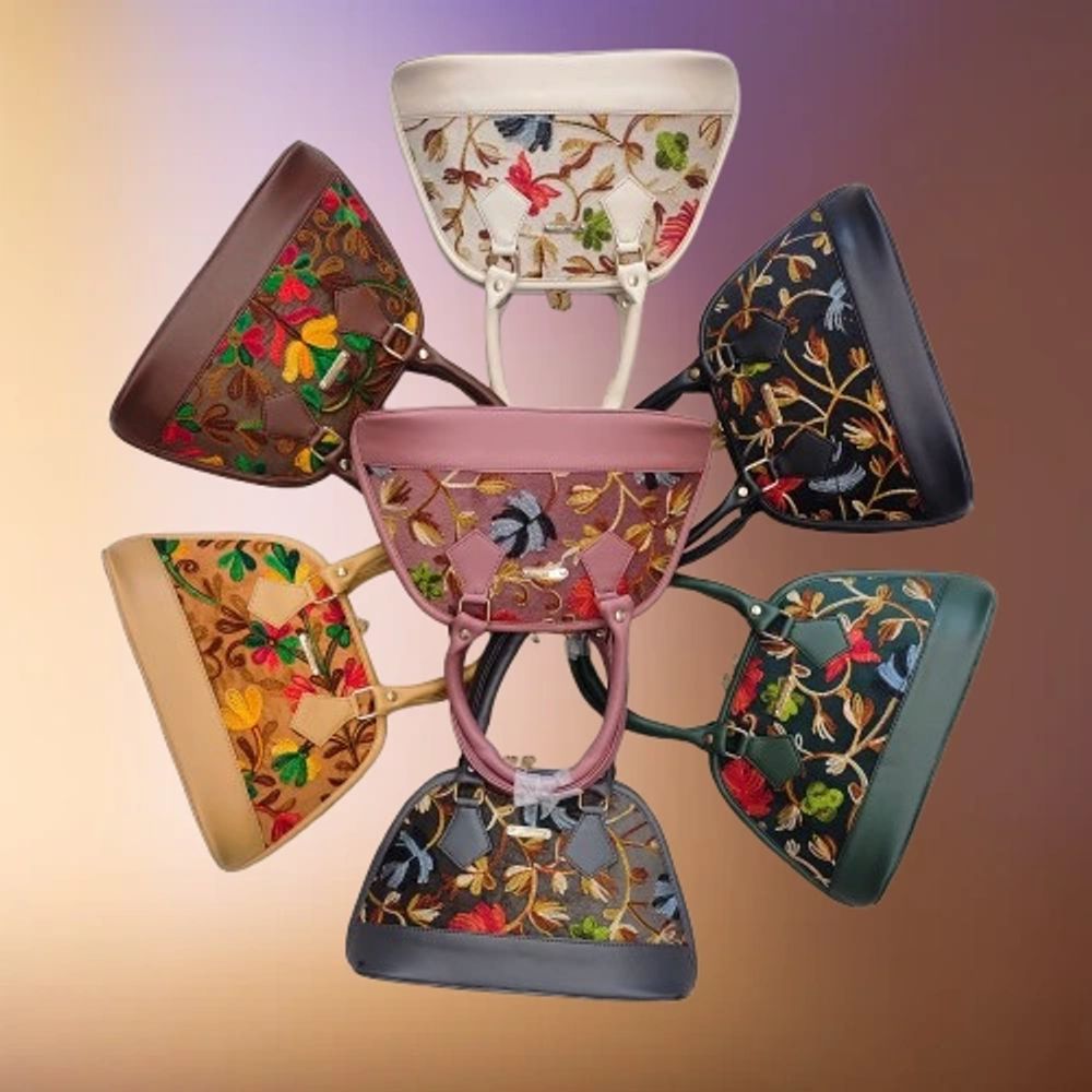 Colorful floral embroidered handbags arranged in a circle.