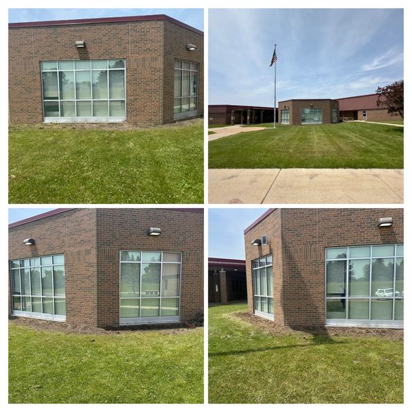 Exterior views of a brick building with large windows and green lawn.