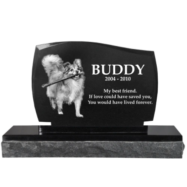 Dog memorial headstone engraved with a dog's image and loving message.