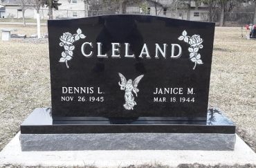 Gravestone with the name Cleland and birth dates for Dennis L. and Janice M.