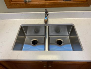 A clean double stainless steel sink.