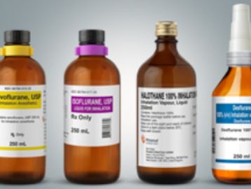 Four bottles of medical anesthetic agents with clear labels and different colored caps.