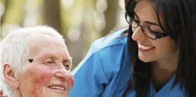 Caregiver shares a laugh with elder