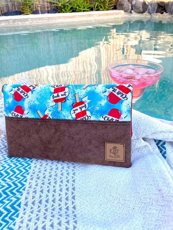 Just Chill clutch with pink gin by the pool.