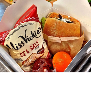 Boxed lunch with sandwich, chips, cookie, and fruit – ideal for Denver corporate catering events