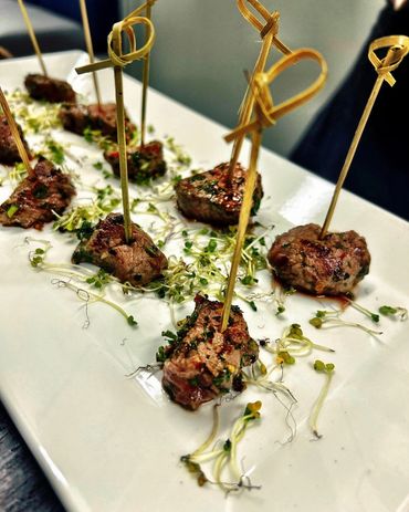 Tender Steak Bites with microgreens—elegant passed hors d'oeuvres for Denver events