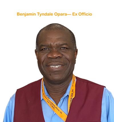Portrait of a smiling man wearing a maroon vest and orange lanyard.