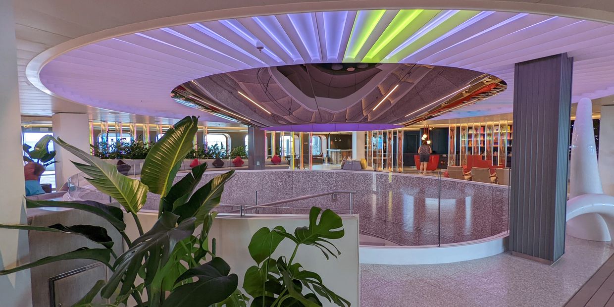 Modern circular atrium with boutique hotel design in the RoundAbout on Virgin Voyages.