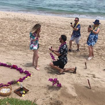 Marriage proposal on Maui beach, flower heart