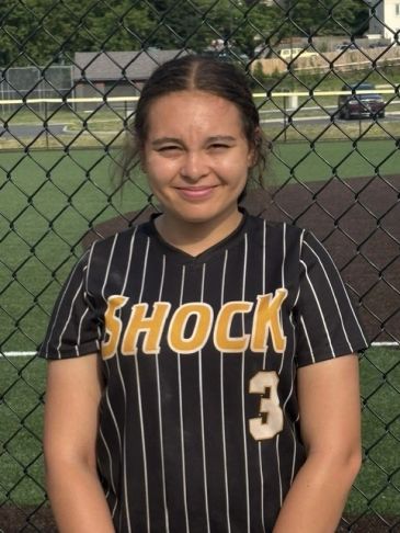 Young softball player in black and gold uniform.