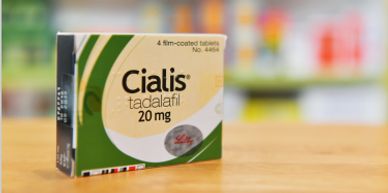 Box of Cialis tadalafil 20 mg tablets on a surface.