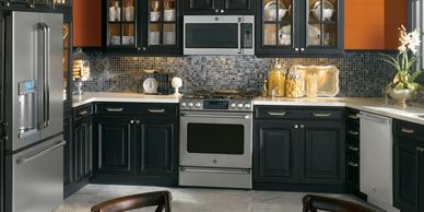 a clean grey and black themed kitchen 