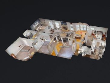 3D floor plan of a house showing labeled rooms and layout.