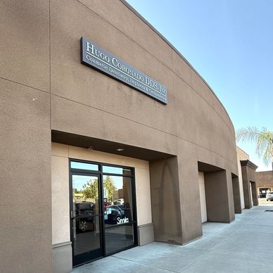 Exterior of Hugo Coronado DDS dental office with clear signage.