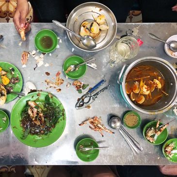 A messy table at a small, alley restaurant in Saigon, Vietnam