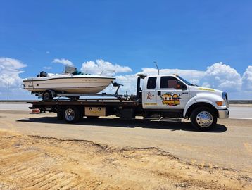tow truck towing a boat
