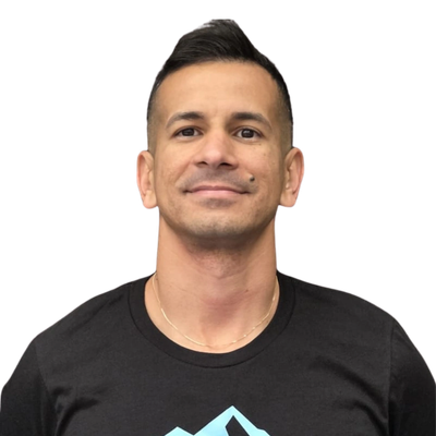 Man smiling in a black t-shirt.