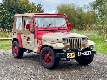 JP04 Jurassic Park Jeep parked on gravel with soft top and winch