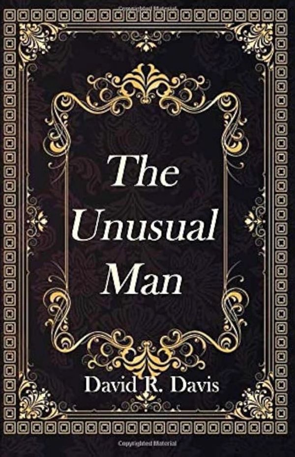 Book cover of "The Unusual Man" by David R. Davis with an ornate black and gold design.