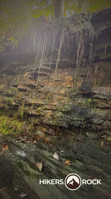 A small amount of water falling over a waterfall. 