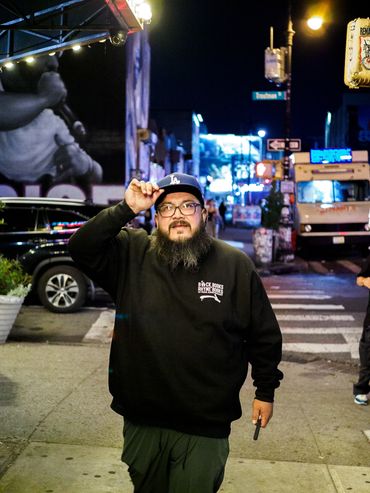 Celebrating Blackbooks and RhymeBooks out in New York, Beirdoh modeling with merchandise