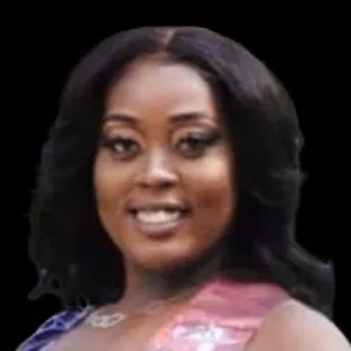 Portrait of a smiling woman with styled hair against a black background.