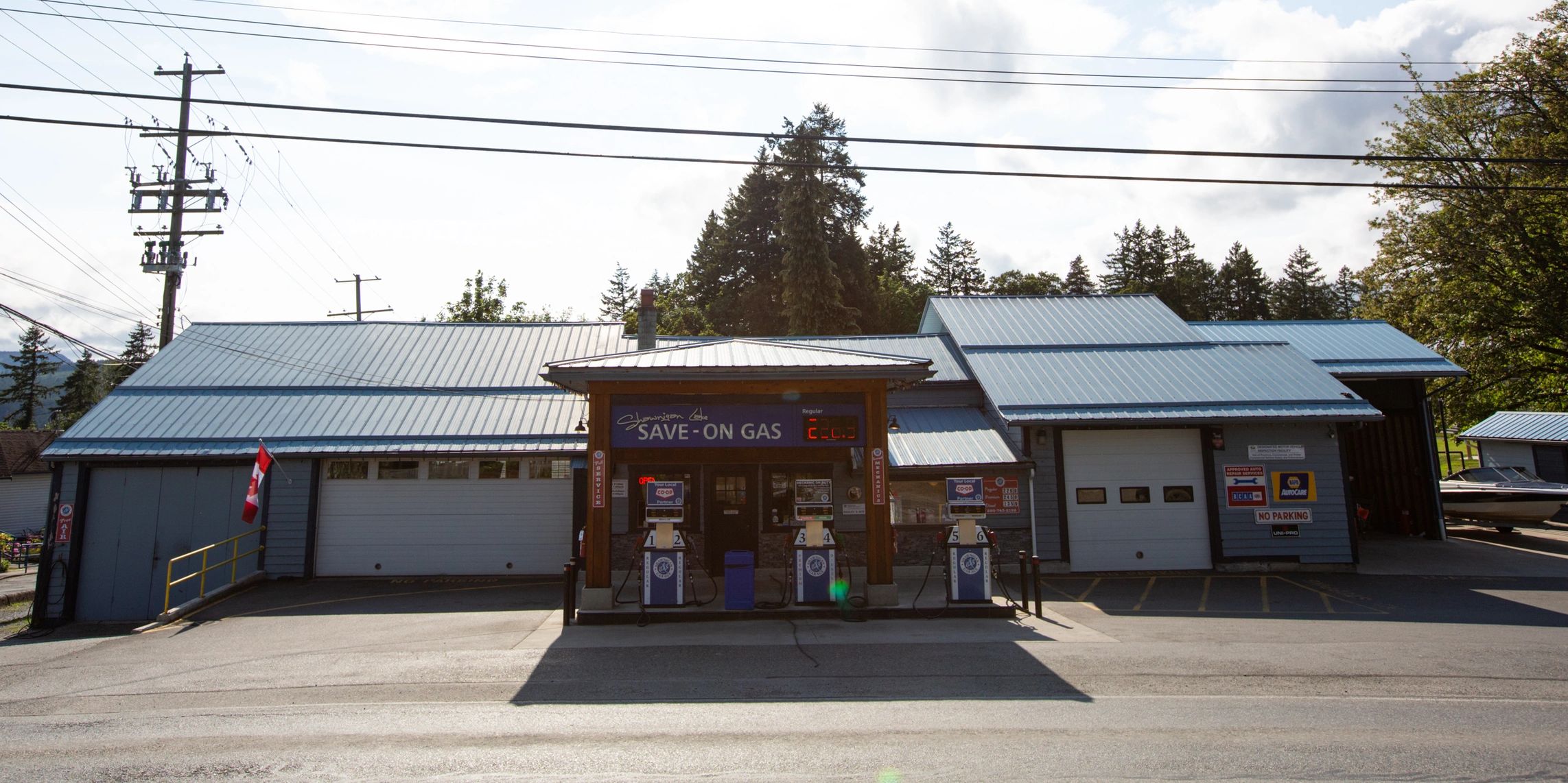 exterior of small blue gas station Shawnigan Garage in Shawnigan Lake on a bright sunny day