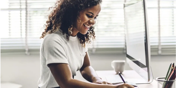 Woman enjoying progress being made during online therapy session.