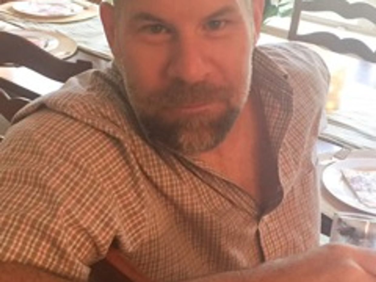 Photo of artist, Mark Nylund enjoying a meal at a family event.