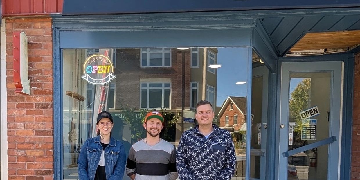 Group shot of the owners of Sage Fish Market in front of Sage Fish Market.