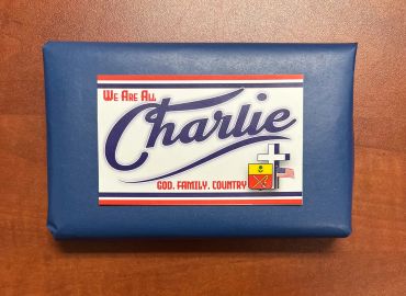 Gift wrapped in blue paper with a card saying "We Are All Charlie".