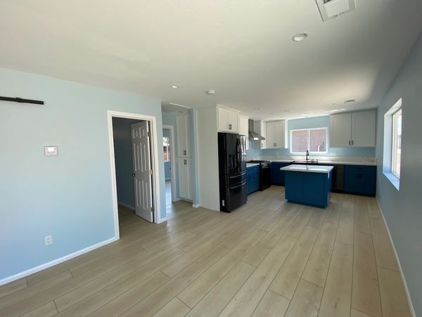 Living area and kitchen remodel with new cabinets, flooring and paint