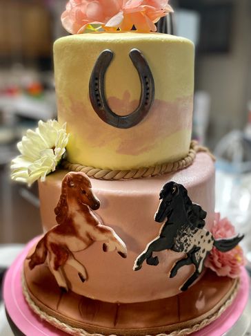 Two tier cake with fondant accents