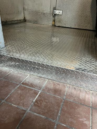 Custom 3003 H22 aluminum threshold repair for a commercial walk-in cooler to eliminate trip hazards 