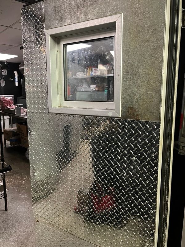 restoration of a commercial walk-in cooler door using high-grade 3003 H22 aluminum in St Pete