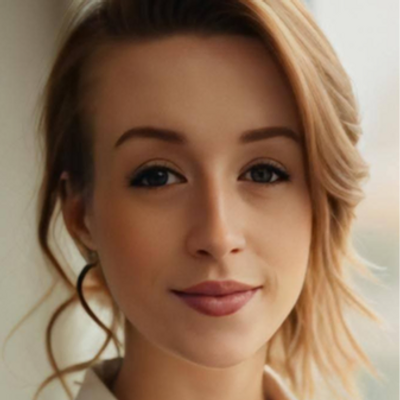 Close-up portrait of a young woman with light brown hair and soft makeup.