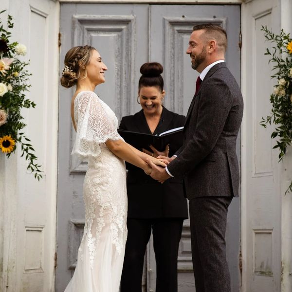 Couple exchanging vows in intimate wedding ceremony.