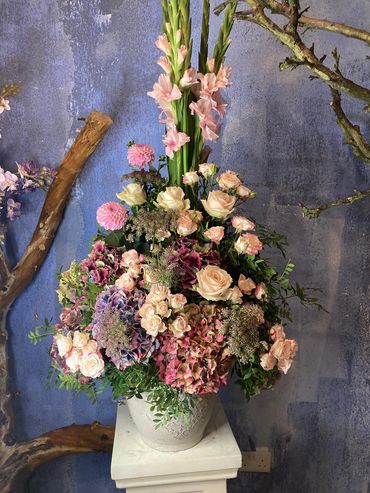 Elegant flower arrangement in a decorative pot.