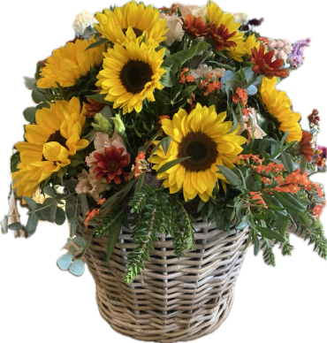 Basket of vibrant sunflowers and mixed flowers.