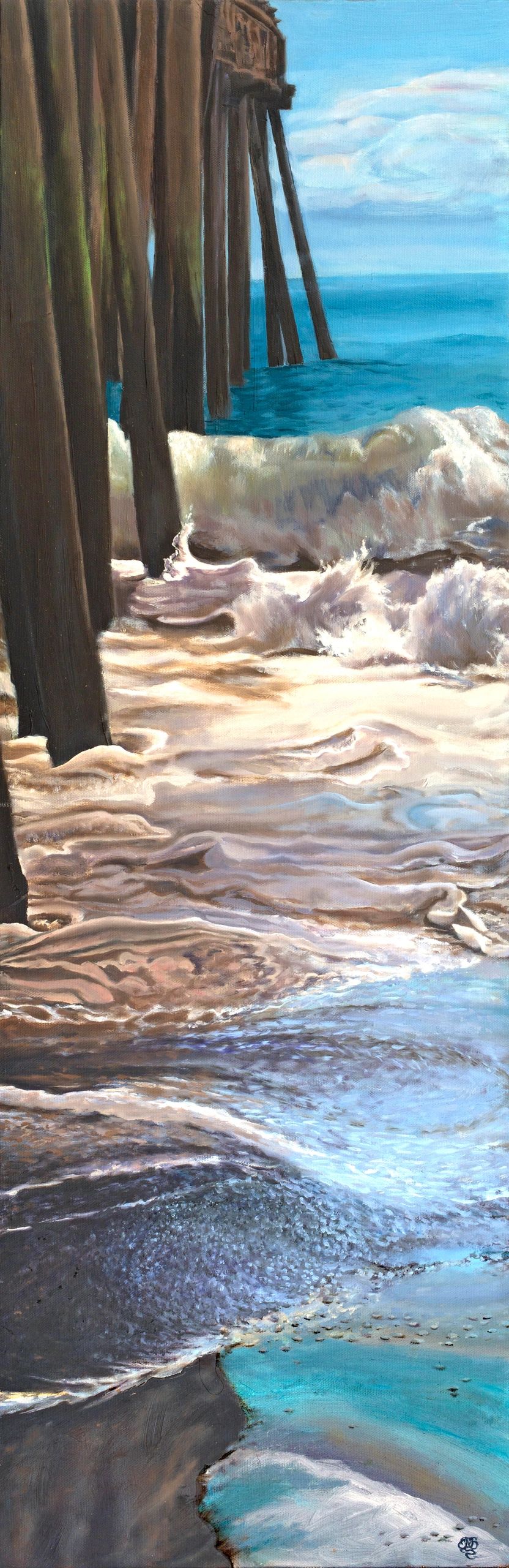 Crashing waves and receding foam beside the base of a tall pier