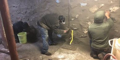 Winchester stone foundation repairs with basement leak repairs.