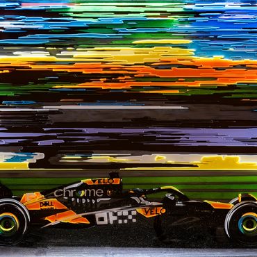 Formula 1 car racing with vibrant streaks in the background.